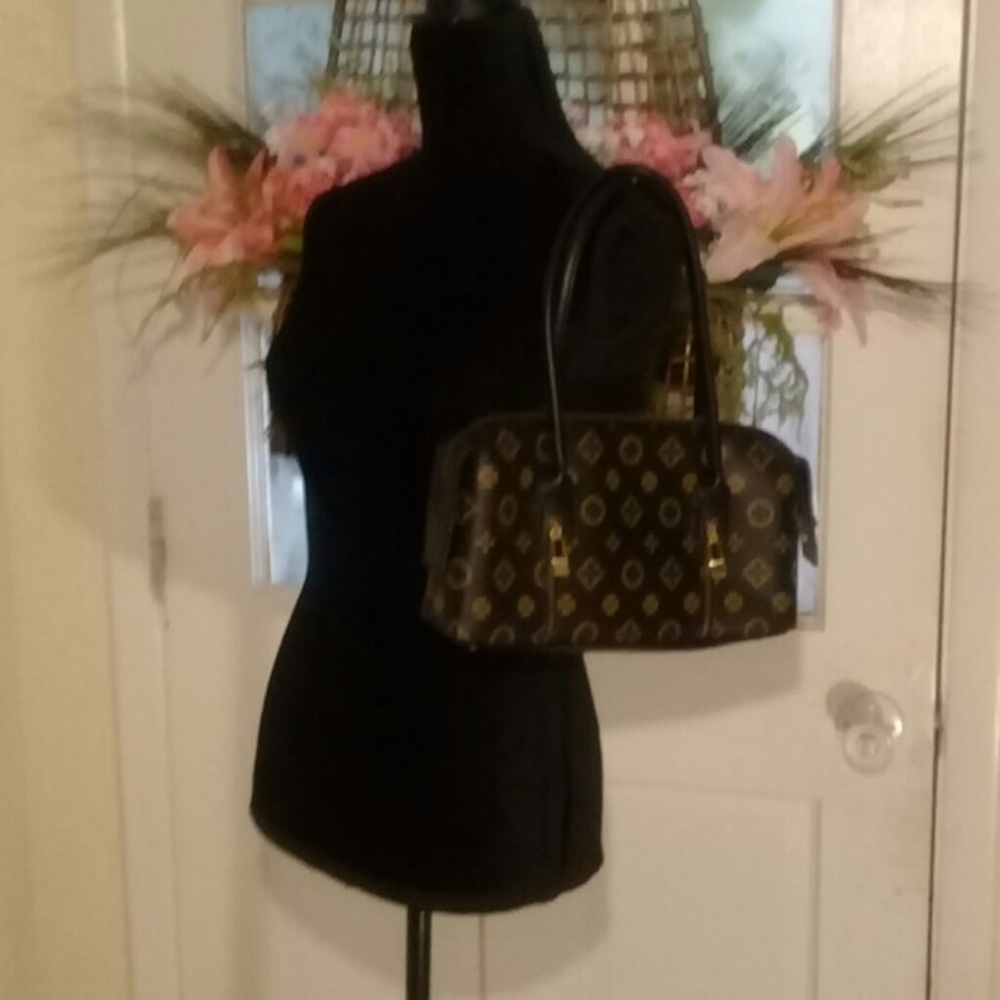 Brown zip and locks fashion bag